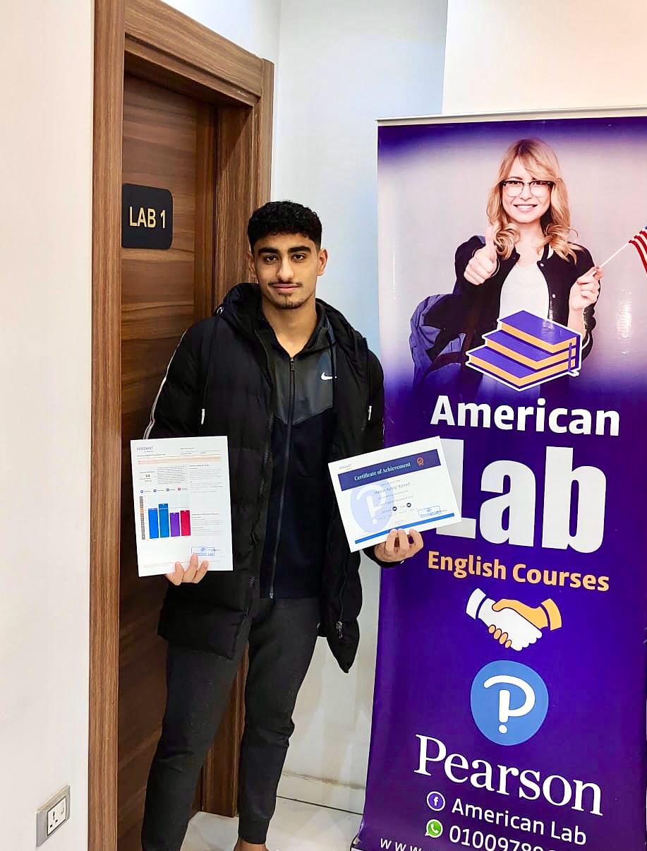 American Lab student holding certificates beside the center branding